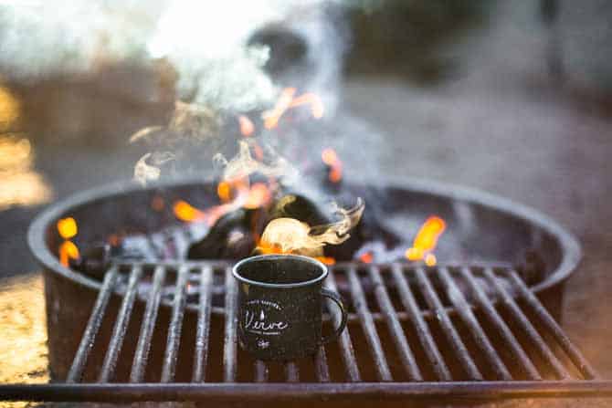 camp charcoal grill flames and smoke with camp grate