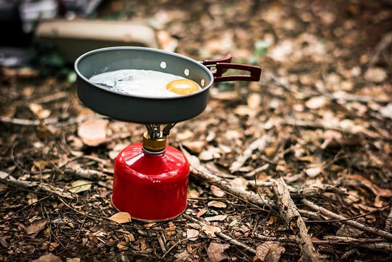 frying pan placed on camping stove