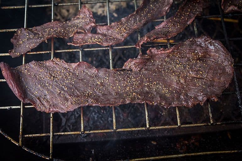 beef jerky resting on grill