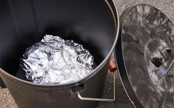 charcoal wrapped in aluminum and placed in metallic bin