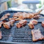 bbq rib platter cooking on large grill