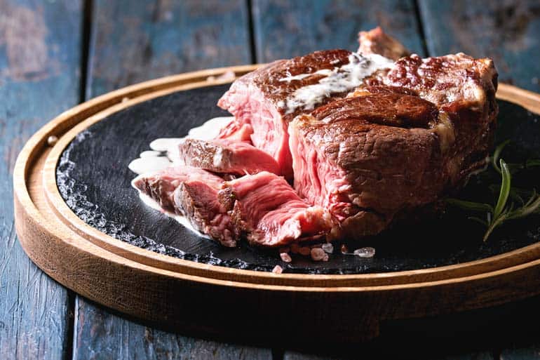 tomahawk steak served on plate