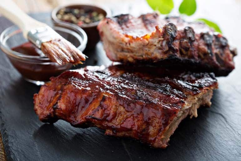 bbq ribs covered in homemade barbecue sauce