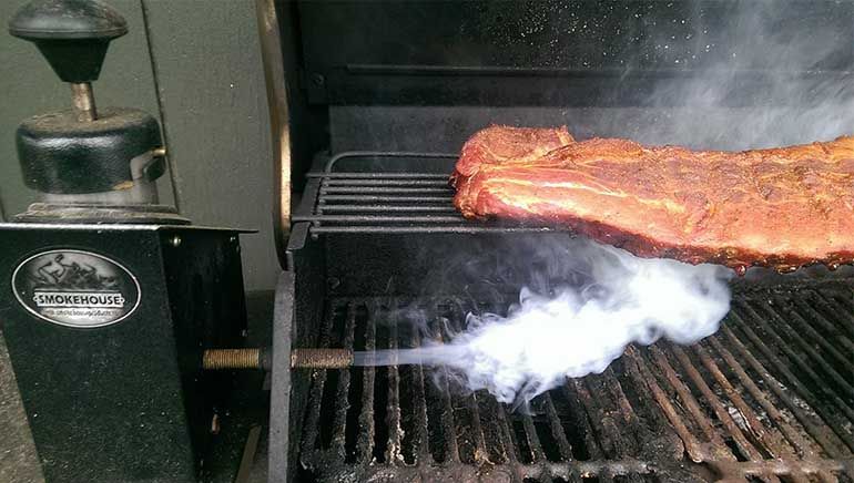 smokehouse smoke chef cold smoke generator on grill grates cooking pork ribs