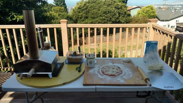 pizza oven resting on patio table