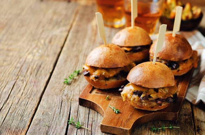 grilled bison sliders sitting on serving board