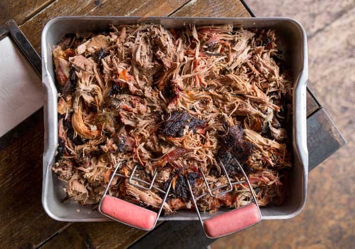 shredded pork in large container