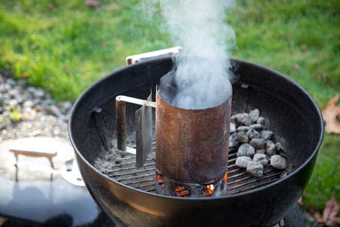 charcoal chimney lit on grill