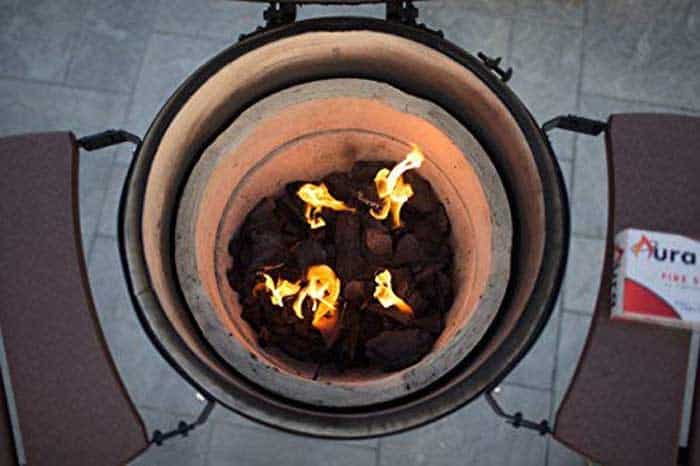 coal fire lit and burning in kamado ceramic grill