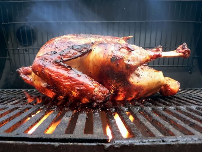 turkey smoking on grill surface