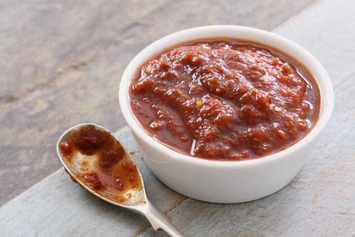 easy homemade chipotle bbq sauce in bowl and serving spoon