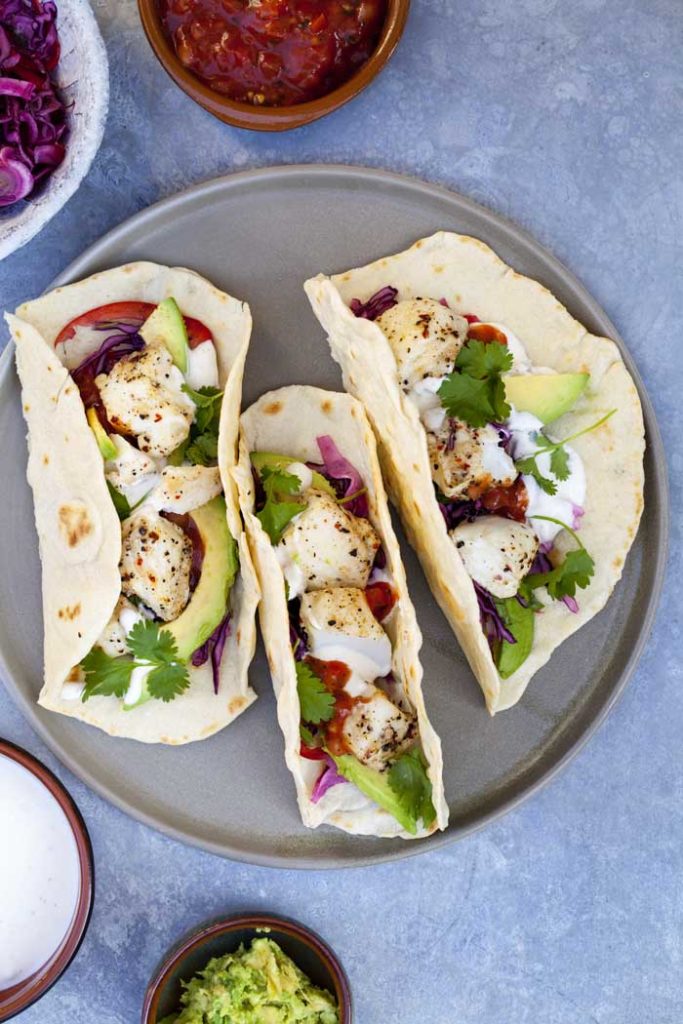 fish tacos with avocado and lime