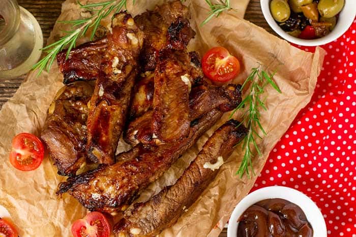 bbq smoked riblets served with bbq sauce