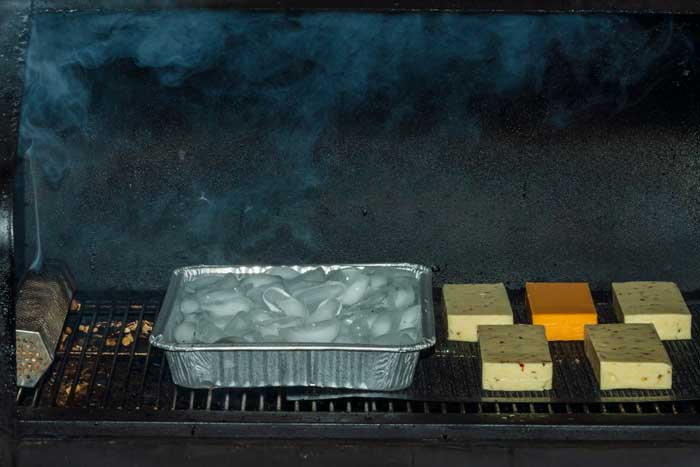 water pan in offset smoker smoking cheese