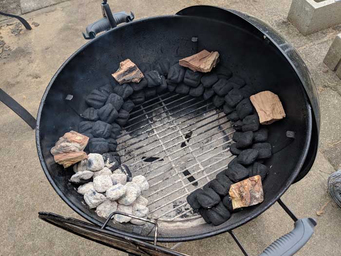 coals lit at one end for charcoal grill snake method