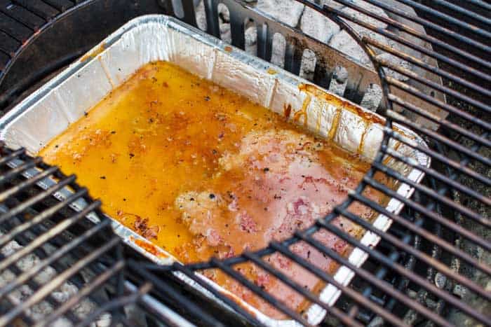 water pan underneath grates catching drippings