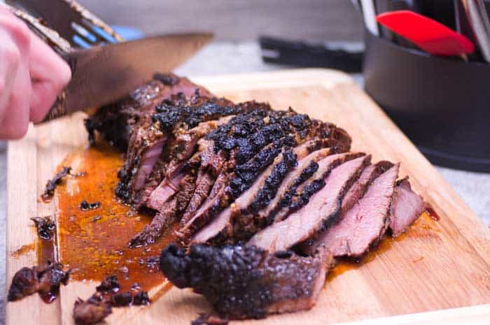 Sliced Fresh Grilled Tri Tip Steak on Wood Cutting Board