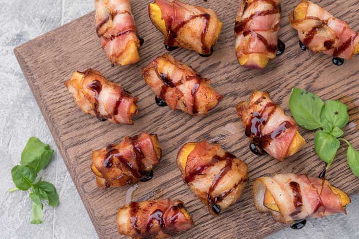 Grilled bacon wrapped peaches
