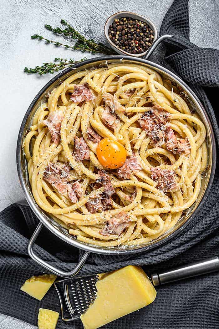 Traditional italian dish spaghetti carbonara with leftover smoked ham