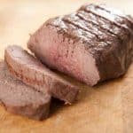 beef tenderloin roast sliced cutting board
