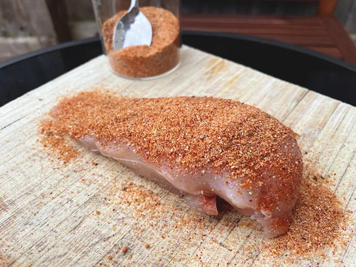 sweet bbq dry rub on raw chicken breast before cooking electric smoker