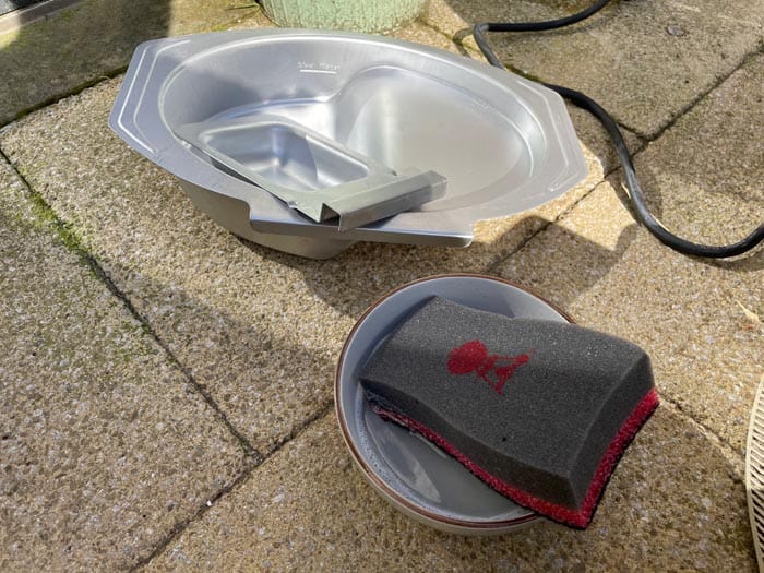 water pan insert drying after being cleaned with sponge and warm soapy water