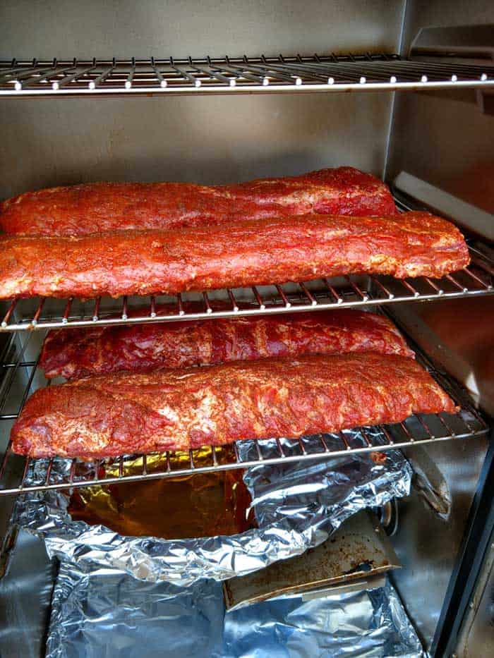 glazed ribs in electric smoker grates