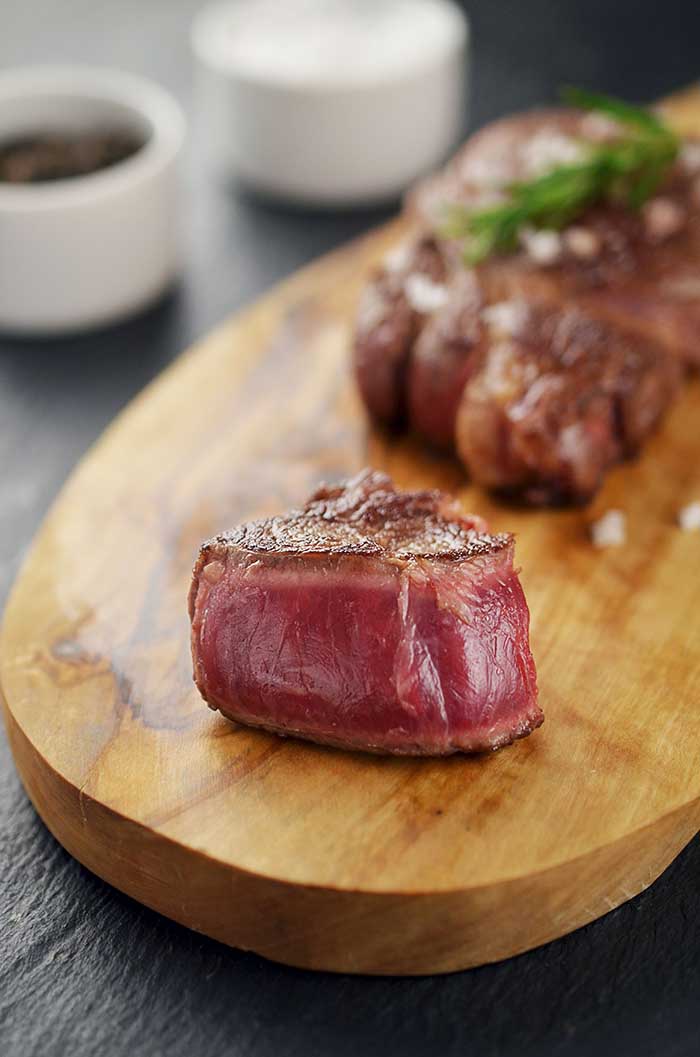 grilled blue rare steak sliced