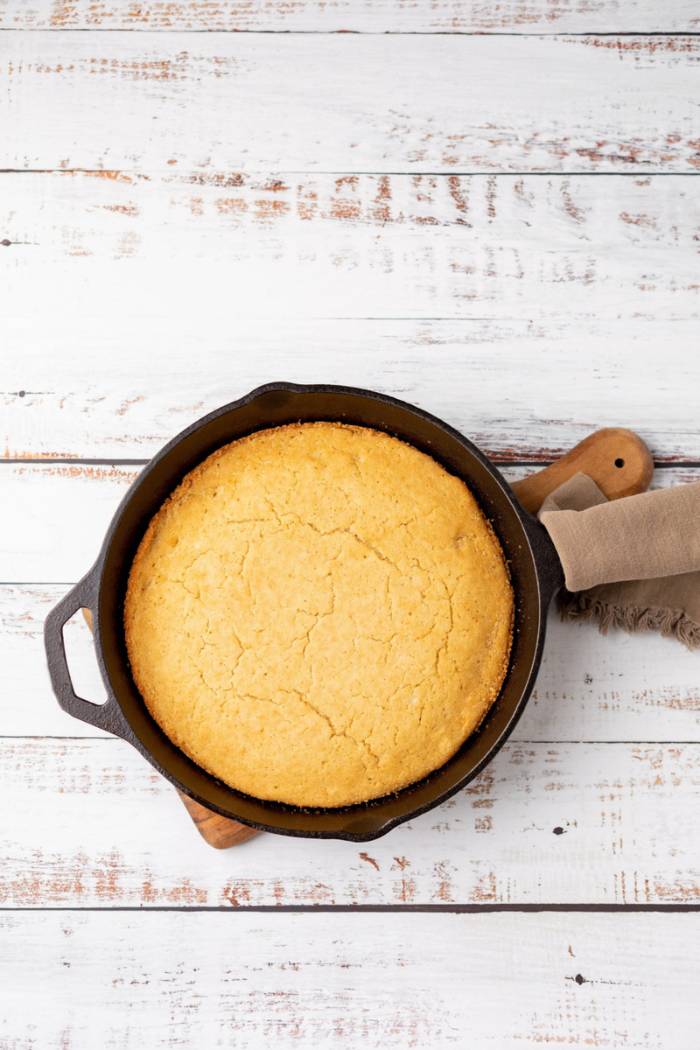 grilled skillet cornbread ready to slice to serve
