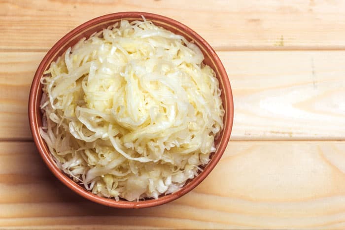 homemade sauerkraut in bowl on table