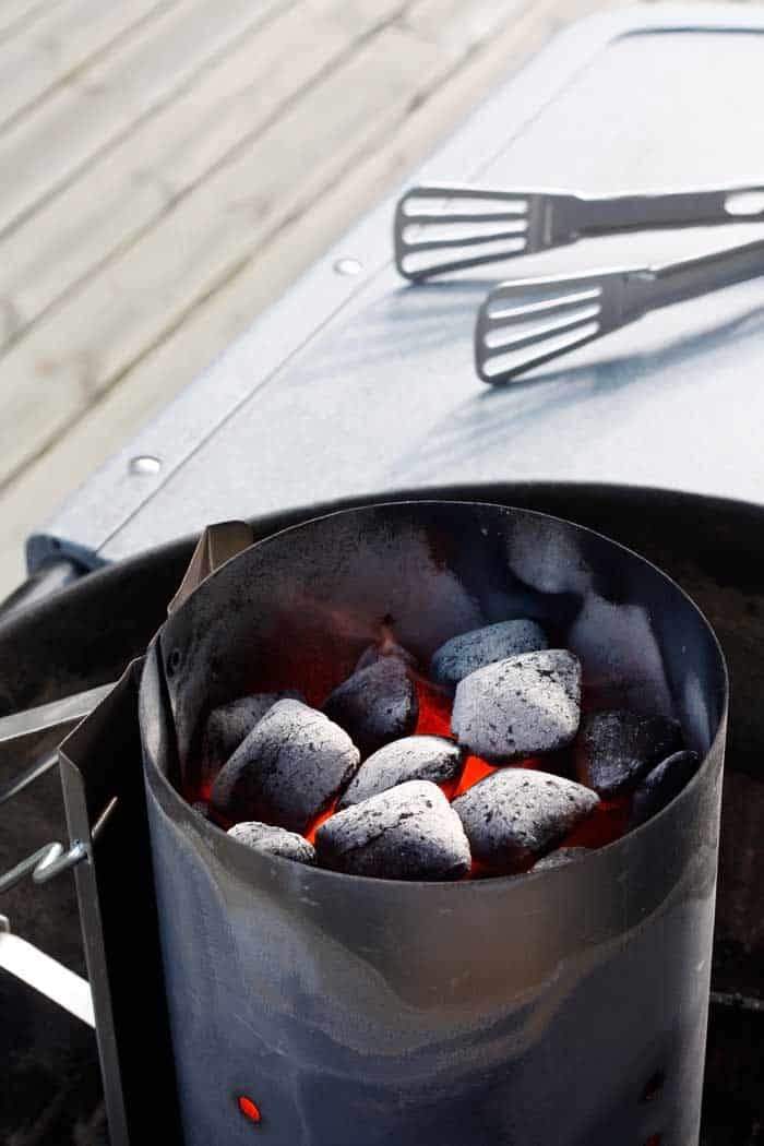 charcoal embers in chimney before grilling