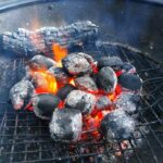 lit charcoal briquettes