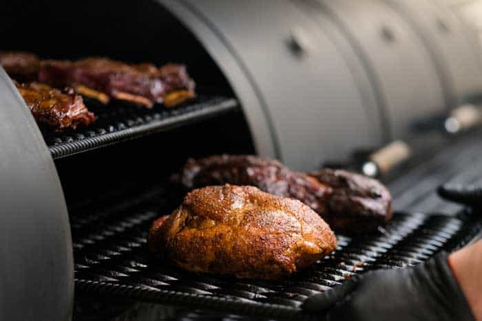 turkey and poultry placed on offset smoker grates