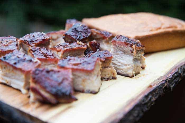 barbecue sliced pork belly cubes on chopping board
