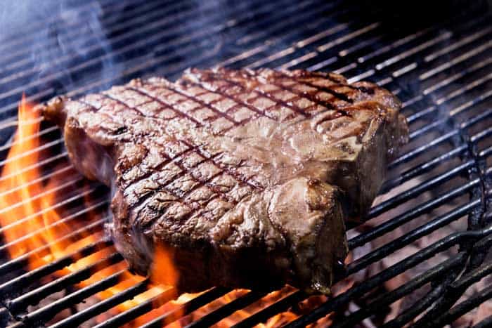 porterhouse steak on grill