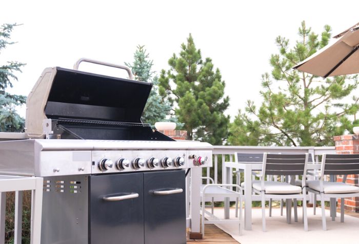 propane gas grill on backyard patio