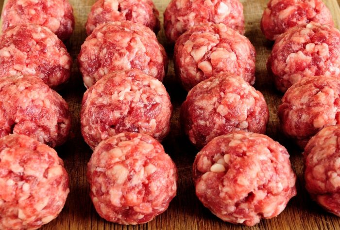 raw homemade ground beef chuck meatballs ready to be cooked