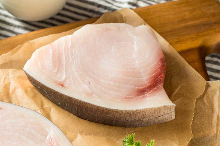 raw sliced swordfish steak