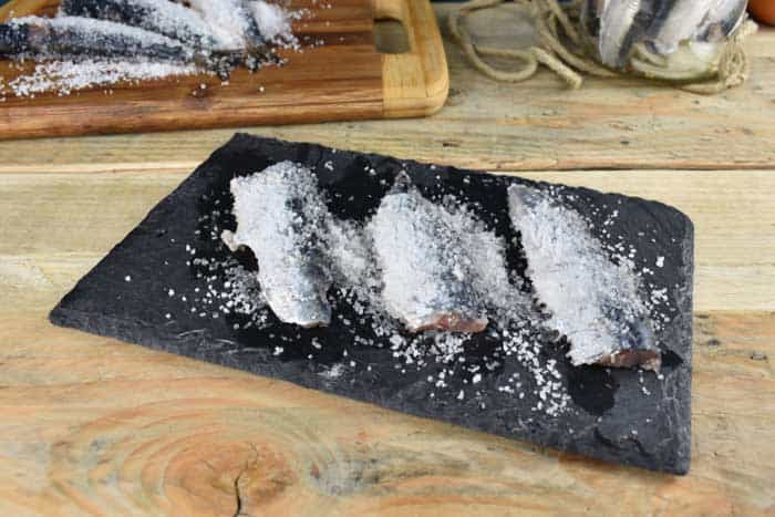 salt dry brine fish on cutting board