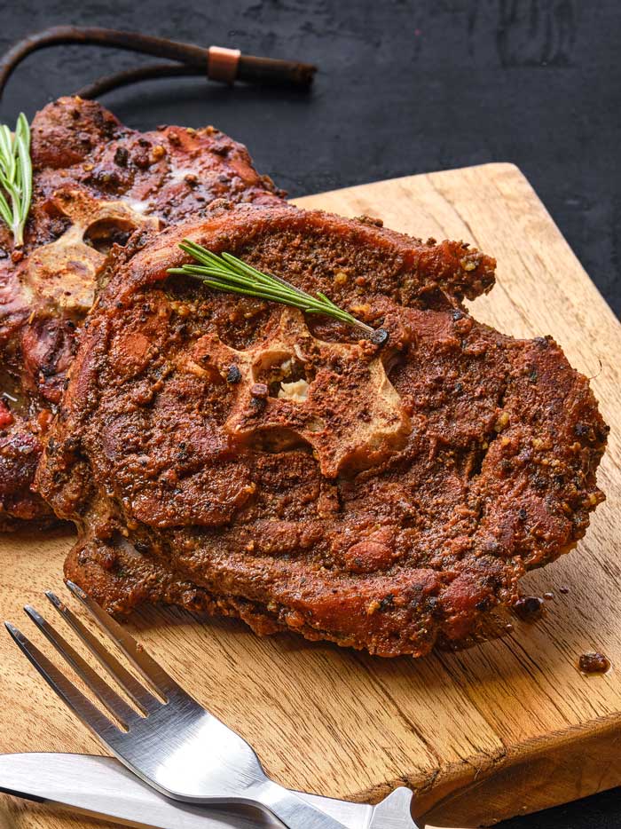 sliced smoked lamb neck chopping board