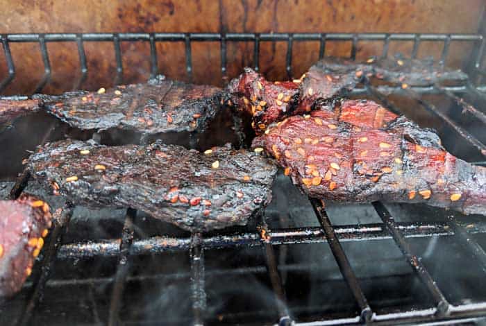 dried beef cooking in smoker