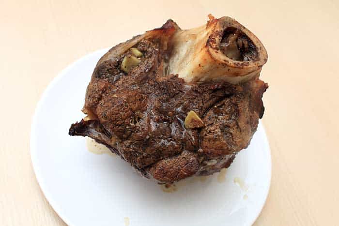 smoked bone-in beef shank shin on white plate