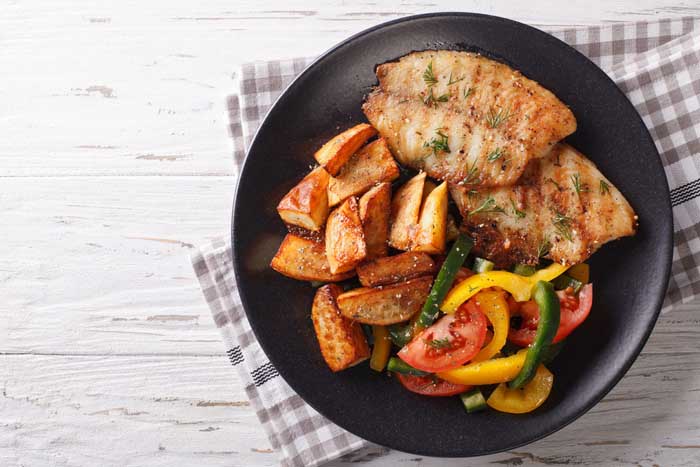 cajun smoked catfish served with grilled vegetables