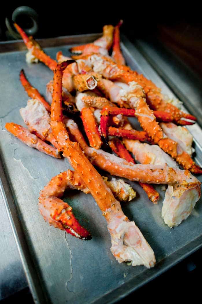 smoked crab legs resting after being barbecued
