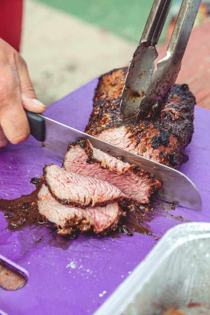 smoked tri-tip sliced on chopping board