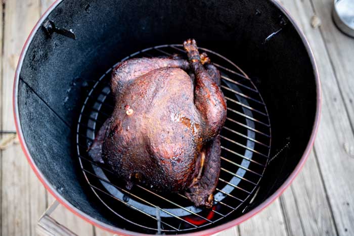 whole turkey chicken in drum bullet smoker